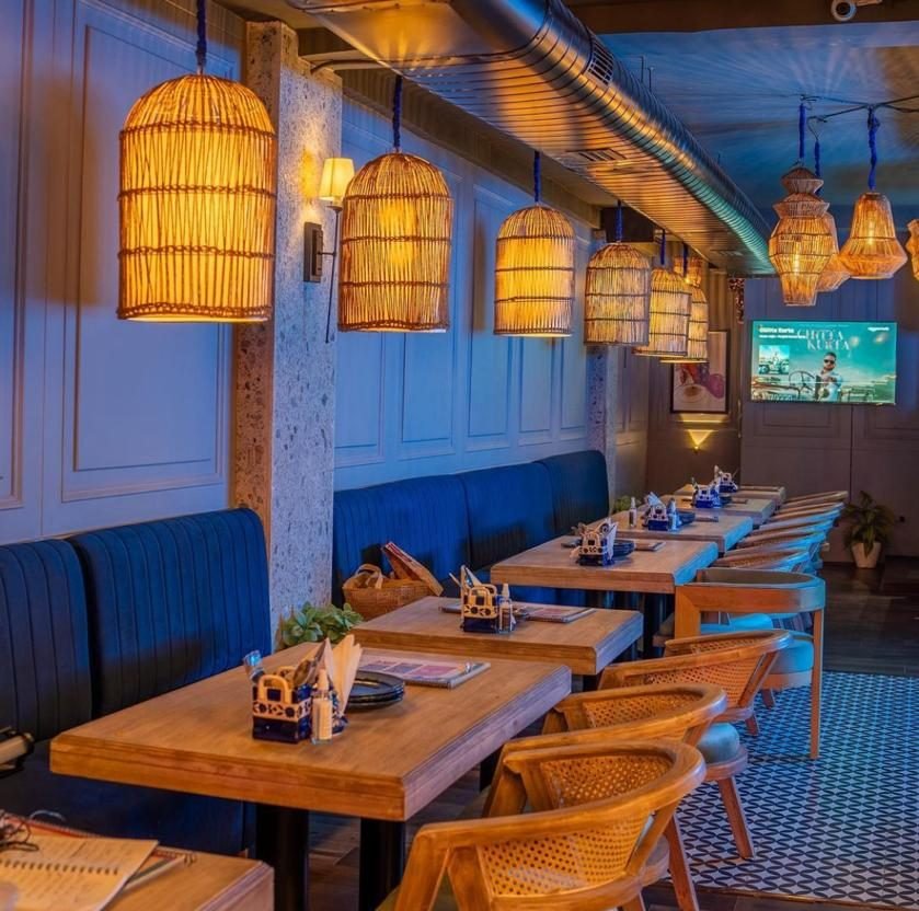 Bistro 57 cane chairs and booth seating, Rohini Delhi