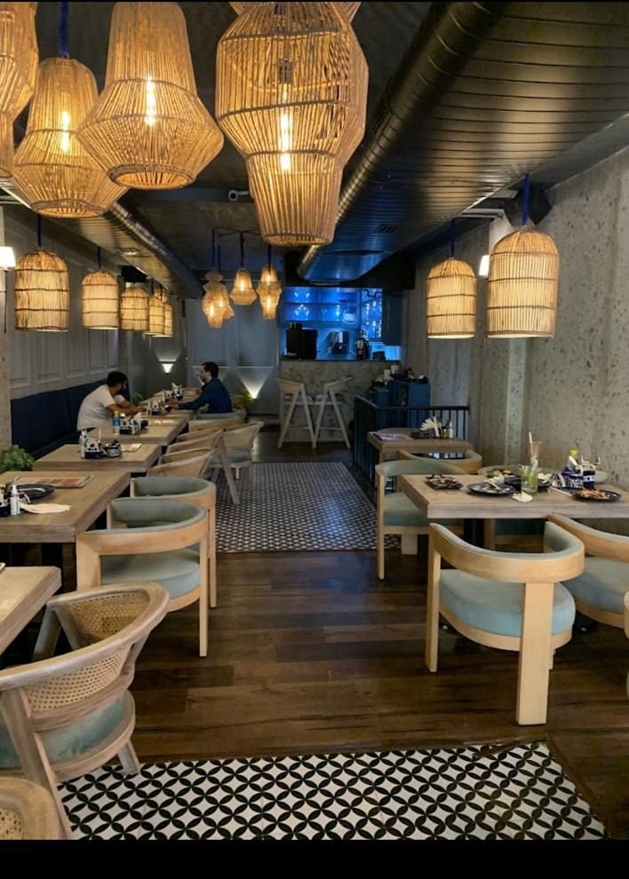 Bistro 57 dining furniture under rattan pendants, Rohini Delhi