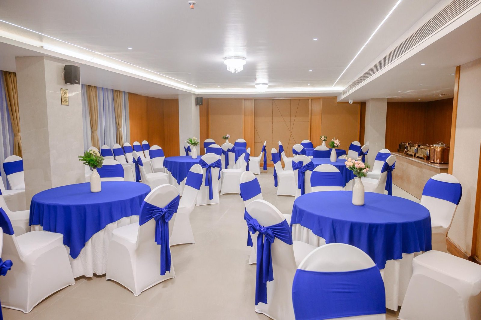 Banquet chairs and round tables setup by Venus Creatives