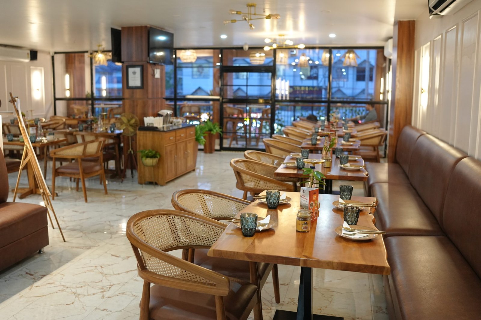 Rattan cafe chairs and live-edge wood tables by Venus Creatives