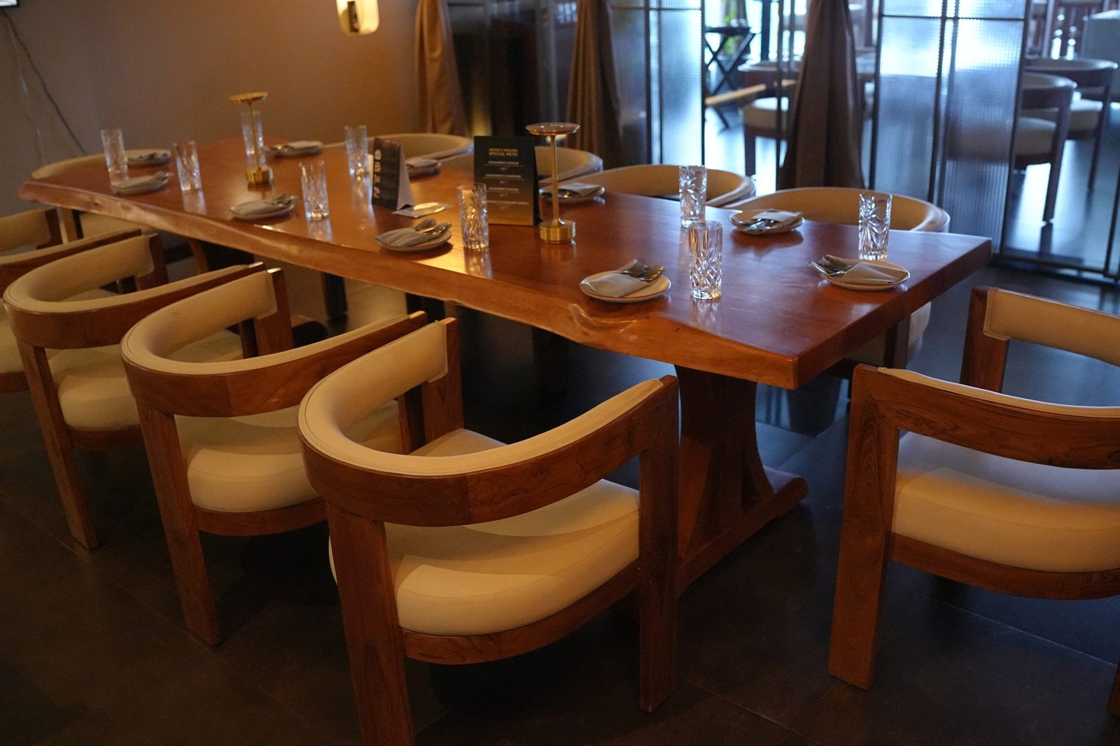 Live-edge wood restaurant table by Venus Creatives