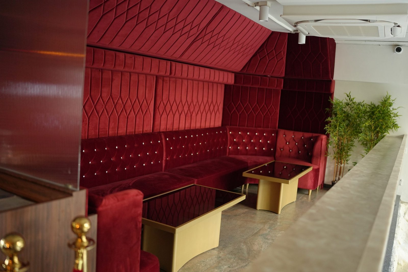 Custom red velvet sofa seating by Venus Creatives